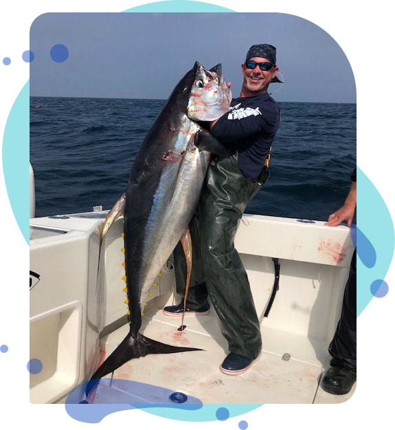 Captain Long holding a tuna